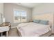 Comfortable bedroom with a large window and light-colored walls providing a bright, welcoming space at 158 Blande Dr, Kenly, NC 27542