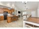 Open concept kitchen with island, stainless appliances, and flows into living area with fireplace at 158 Blande Dr, Kenly, NC 27542