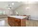 Bright kitchen island with granite countertops, wood cabinets, and an open layout at 158 Blande Dr, Kenly, NC 27542