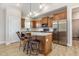 Modern kitchen featuring stainless steel appliances, center island, and wood cabinets at 158 Blande Dr, Kenly, NC 27542