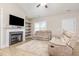 Cozy living room featuring a fireplace, built-in shelves, and comfortable seating at 158 Blande Dr, Kenly, NC 27542