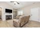 Comfortable living room with a fireplace, built-in shelving, and neutral decor at 158 Blande Dr, Kenly, NC 27542