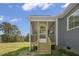 Screened back porch with stairs leading down to the backyard, offering a relaxing outdoor space at 163 S Harper Faith Way, Benson, NC 27504