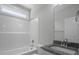 Bathroom showcasing a combination tub and shower with a granite countertop vanity at 163 S Harper Faith Way, Benson, NC 27504