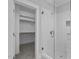 Modern bathroom featuring a glass shower, a walk-in closet, and white subway tile at 163 S Harper Faith Way, Benson, NC 27504