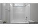 Bathroom displaying a pristine, well-lit tub and shower combination at 163 S Harper Faith Way, Benson, NC 27504