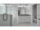 Bright bathroom featuring a double vanity with granite countertop and a tiled walk-in shower with glass door at 163 S Harper Faith Way, Benson, NC 27504