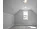 Bright bedroom with gray walls, carpet, and a large window offering plenty of natural light at 163 S Harper Faith Way, Benson, NC 27504