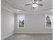 Well-lit room featuring neutral walls, modern ceiling fan, tray ceiling, and ample windows for natural light at 163 S Harper Faith Way, Benson, NC 27504