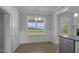 Dining area showcasing wainscoting, natural light and wood look flooring at 163 S Harper Faith Way, Benson, NC 27504