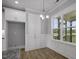 Bright dining area with large windows, chandelier, and crisp, white wainscoting at 163 S Harper Faith Way, Benson, NC 27504