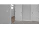Entryway displaying modern, gray walls and trim and carpet transitioning to wood flooring at 163 S Harper Faith Way, Benson, NC 27504