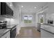 Kitchen featuring stainless appliances, granite counters, and an adjacent dining area at 163 S Harper Faith Way, Benson, NC 27504