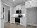 Kitchen featuring white cabinets, granite countertops and stainless appliances at 163 S Harper Faith Way, Benson, NC 27504