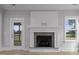 Spacious living room featuring a gas fireplace and views from a window at 163 S Harper Faith Way, Benson, NC 27504