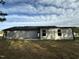 Backyard with bright blue skies and gray siding, offering potential for outdoor enjoyment at 170 Eason Creek Way, Clayton, NC 27527