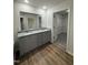 Bathroom with double vanity, granite countertop, and walk-in closet providing ample storage at 170 Eason Creek Way, Clayton, NC 27527