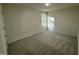 Cozy bedroom with carpet, neutral walls, and natural light from the window at 170 Eason Creek Way, Clayton, NC 27527