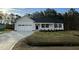 Charming one-story home featuring a manicured lawn, neutral siding, and an attached two-car garage at 170 Eason Creek Way, Clayton, NC 27527