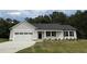 Charming single-story home with a gray exterior, attached garage, and well-manicured front lawn at 170 Eason Creek Way, Clayton, NC 27527