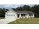 Charming single-story home with a gray exterior, attached garage, and well-manicured front lawn at 170 Eason Creek Way, Clayton, NC 27527
