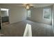 Bright main bedroom featuring soft carpet, dual windows, and an en-suite bathroom at 170 Eason Creek Way, Clayton, NC 27527