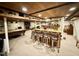 This finished basement boasts a wood-crafted bar, pool table, bar stools and a fireplace at 1802 Greenbriar Rd, Henderson, NC 27536