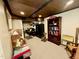 This basement includes a sitting area, shelving, and space for storage and hobbies at 1802 Greenbriar Rd, Henderson, NC 27536
