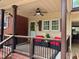 Inviting front porch with comfortable seating and stylish decor at 1802 Greenbriar Rd, Henderson, NC 27536