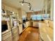Modern kitchen featuring stainless steel appliances, granite countertops and warm hardwood floors at 1802 Greenbriar Rd, Henderson, NC 27536