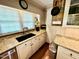 Sunlit kitchen boasts granite countertops, stainless appliances, and custom cabinetry at 1802 Greenbriar Rd, Henderson, NC 27536