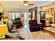 Cozy living room featuring warm hardwood floors and comfortable leather seating at 1802 Greenbriar Rd, Henderson, NC 27536