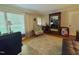 Office with natural light has a desk, golf clubs and a large mirror at 1802 Greenbriar Rd, Henderson, NC 27536