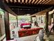 Expansive outdoor living space with a swing, comfortable seating, and decorative elements at 1802 Greenbriar Rd, Henderson, NC 27536