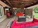 Spacious covered patio with comfortable seating and outdoor entertainment area at 1802 Greenbriar Rd, Henderson, NC 27536