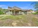 Spacious backyard with a well-maintained lawn and a covered patio perfect for outdoor entertaining at 181 Fawn Hill Ct, Garner, NC 27529