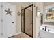 Bathroom featuring a glass shower, a soaking tub, and decor at 181 Fawn Hill Ct, Garner, NC 27529