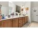 Bright Primary bathroom with double vanity, large mirrors, and modern lighting at 181 Fawn Hill Ct, Garner, NC 27529