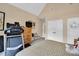 Cozy bedroom featuring a treadmill, dresser, and ample closet space at 181 Fawn Hill Ct, Garner, NC 27529