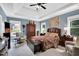 Serene bedroom suite with tray ceilings and natural light with furnishings, creating a calming retreat at 181 Fawn Hill Ct, Garner, NC 27529
