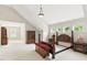 Spacious, neutral bedroom with a wood bed frame, bedside tables, and ample natural light at 181 Fawn Hill Ct, Garner, NC 27529