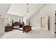 Bright, neutral bedroom with a wood bed frame, bedside tables, and ample natural light at 181 Fawn Hill Ct, Garner, NC 27529