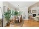 Bright dining area with a view to the outdoor patio, adjacent to a well-lit living space at 181 Fawn Hill Ct, Garner, NC 27529