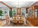 Traditional dining room featuring a large table, ample seating, and natural light at 181 Fawn Hill Ct, Garner, NC 27529