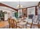 Cozy dining room featuring hardwood floors, a decorative chandelier, and ample seating for Gathering gatherings at 181 Fawn Hill Ct, Garner, NC 27529