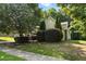 Well-maintained home exterior with mature trees and lush landscaping at 181 Fawn Hill Ct, Garner, NC 27529