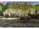Charming two-story home featuring a well-manicured lawn, mature tree, and inviting curb appeal with a two car garage at 181 Fawn Hill Ct, Garner, NC 27529