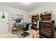 Functional home office with desk, computer, bookshelf, organized files, and decor at 181 Fawn Hill Ct, Garner, NC 27529