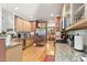 Well-lit kitchen featuring granite countertops, stainless steel appliances, and ample cabinet space at 181 Fawn Hill Ct, Garner, NC 27529