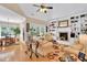 Bright and airy living room with hardwood floors, built-in shelving, and a cozy fireplace at 181 Fawn Hill Ct, Garner, NC 27529
